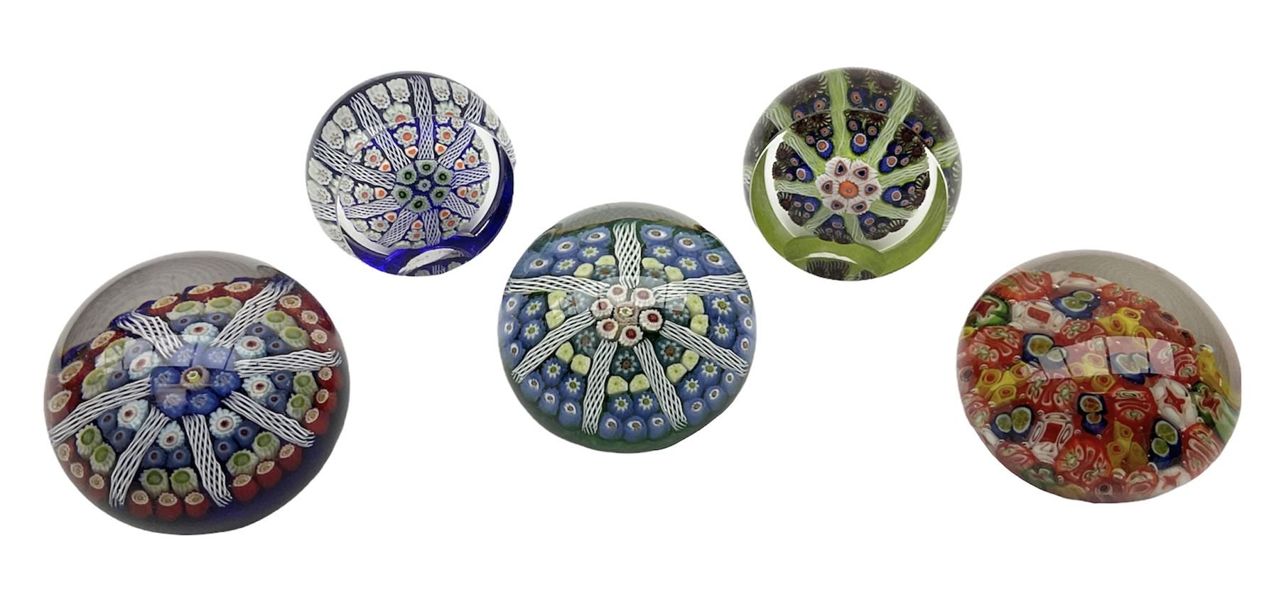 Five Millefiori glass paperweights, of differing designs, predominately by Strathearn