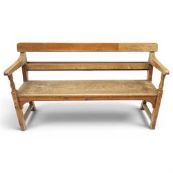 Early 20th century pine chapel bench, with moulded plank back rail over plain rail, with b...