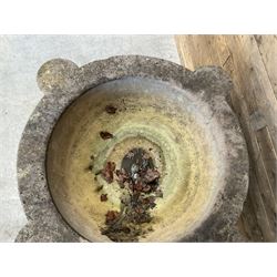 Large 19th century circular stone mortar planter on wrought iron stand