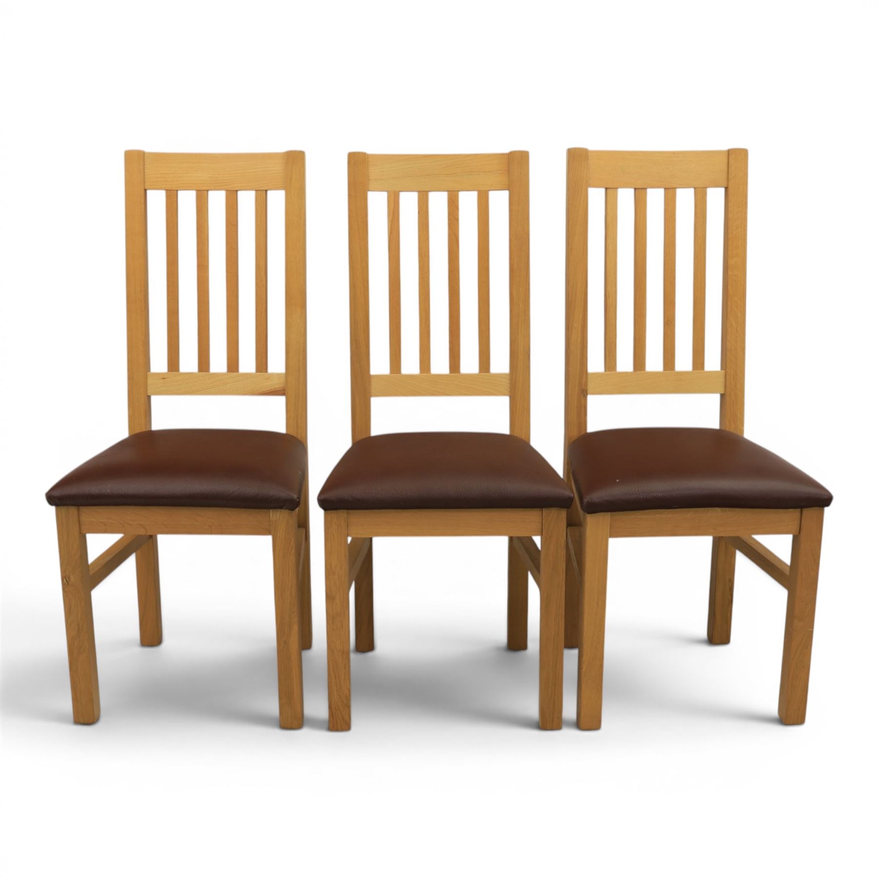 Modern solid oak dining table with set six chairs, chairs with brown leatherette seat