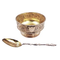 Victorian silver bowl, with embossed floral decoration and beaded rim, gilt interior and two applied shield cartouches, upon stepped circular foot, with a silver apostle spoon, with gilt bowl, both hallmarked George Unite, Birmingham 1883, bowl H5.5cm, within fitted tooled leather, silk lined case