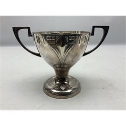 Pair of early 20th century WMF silver plated twin handled pedestal trophies, the bowl-shaped cups with Art Nouveau stylised relief decoration and pierced rim raised upon circular spreading foot similarly decorated, with stamped marks beneath, H12cm