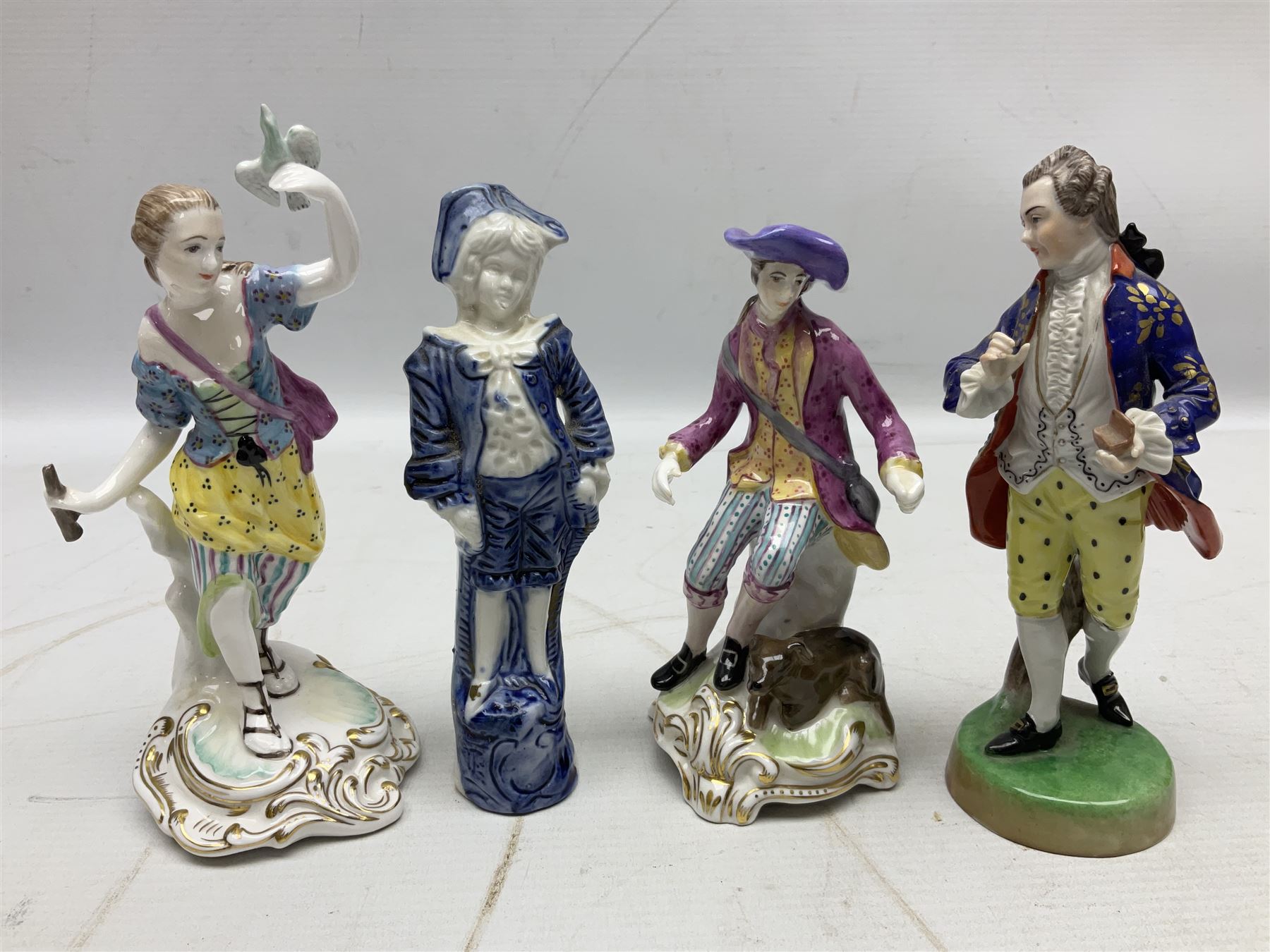 Seven Spode Chelsea figures, comprising no.1, no.2, no.3, no.4, no.6 and two further smaller examples, together with a Dresden figure of a gentleman, no. K10003, and a Delft style figure of a boy, some with boxes, tallest H23cm (9)