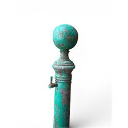 19th century circular cast iron gate post with finial, painted in distressed green finish