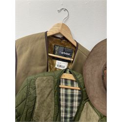 A ladies Barbour quilted dark green jacket, size 14, together with a further Barbour green quilted jacket, no size label, two Barbour 'pile lining' gilets/jacket inserts, two Barbour hats, three Akubra 'pure fur felt' hats, etc. 