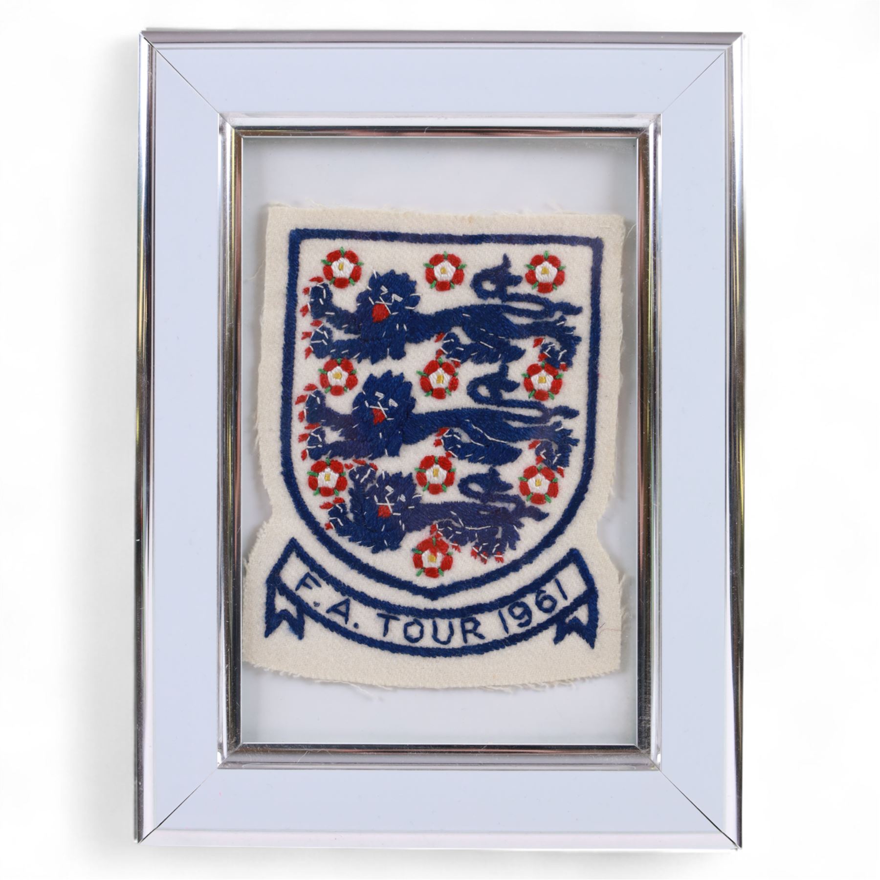 1960s three lions embroidered cloth badge from an England football shirt, reading F.A. Tour 1961, framed