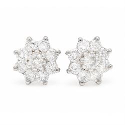 Pair of 18ct white gold diamond flower head earrings, each stud set with nine round brilliant cut diamonds, Birmingham 1996, total diamond weight approx 1.20 carat
