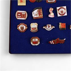 Twenty-one Manchester United enamel pin badges, including 1968 European Cup Winners example and a 1977 FA Jubilee Cup Winners example