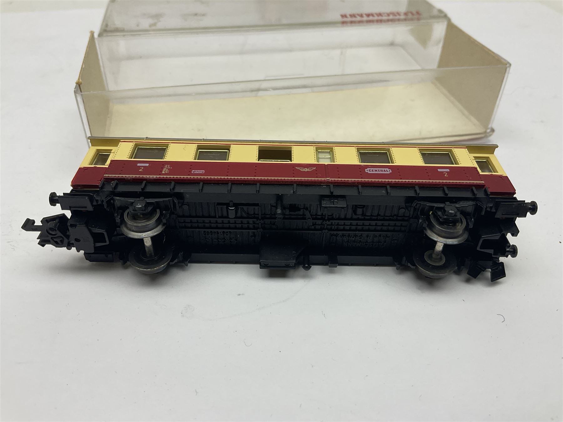 Fleischmann ‘N’ gauge ‘Piccolo’ - sixteen carriages, wagons and cars comprising nos. 8051, 8052, 8055, 8064, 8119K, 8127, 8128, 8129, 8202, 8211, 8224, 8240, 8281, 8301, 8500, 9372; along with Minitrix N503 Shock Van and 13576 6 ton Mineral Wagon; boxed and loose (18) 
