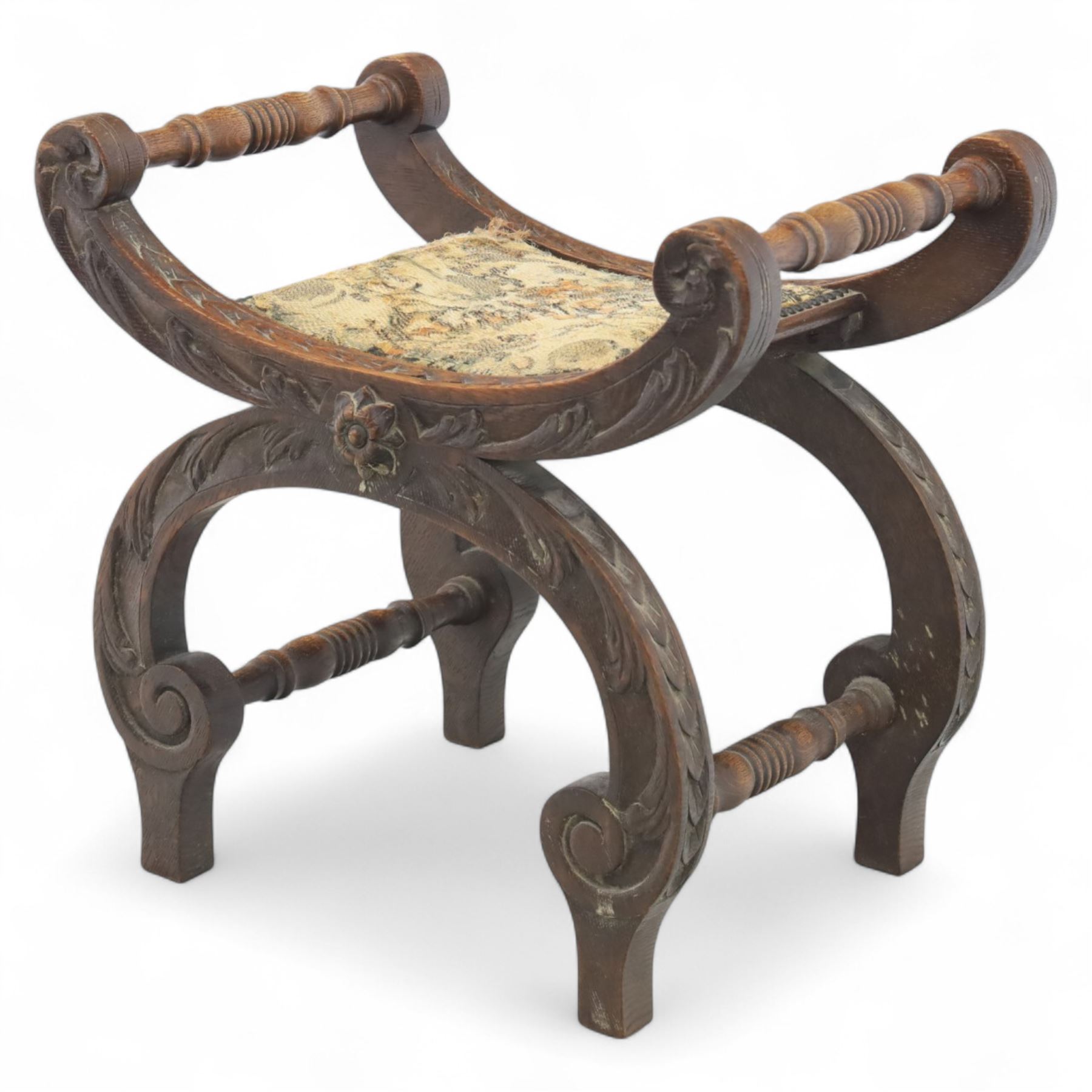 Late 19th century carved oak X-frame stool with tapestry seat