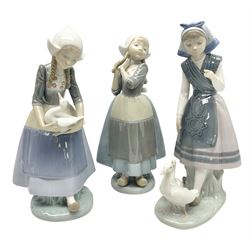 Three Lladro figures, comprising Dutch Girl with Braids no 5063, Dutch Girl with Duck no 5066 and Aracely with Ducks, all with original boxes, largest example H25cm
