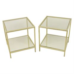 Modern pair of brass finish and glass bedside stands, each of square form with clear glass...