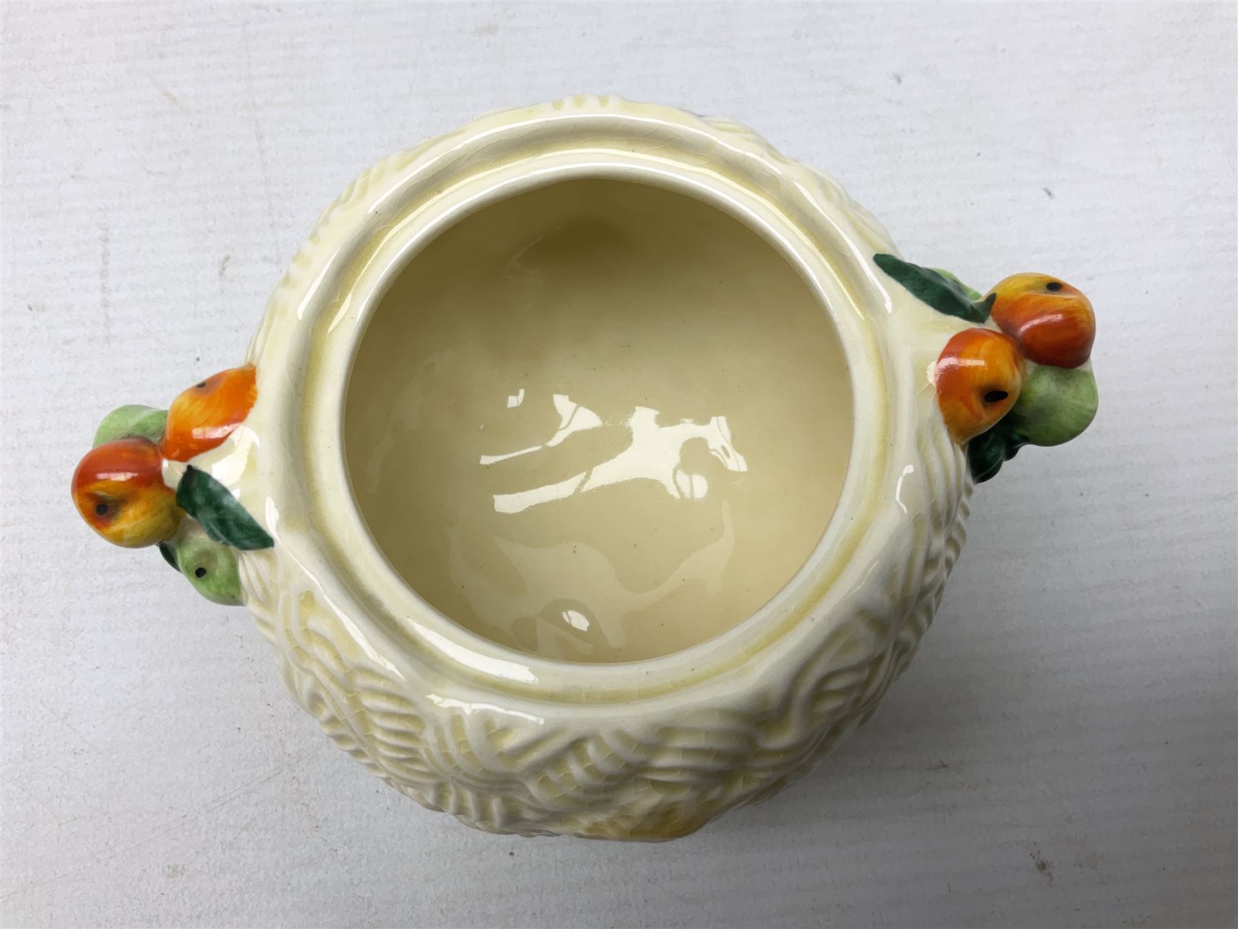 Clarice Cliff Celtic Harvest pattern sugar bowl, with original silver plate cover upon basket weave effect spherical body decorated with raised stylised fruit, H11cm