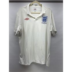 Fourteen items of replica sporting clothing including Leeds United football club shirts, England jerseys etc