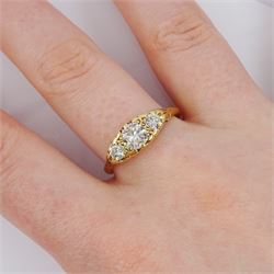 Gold three stone round brilliant cut diamond ring, stamped 18ct, principal diamond approx 0.50 carat, total diamond weight approx 0.70 carat