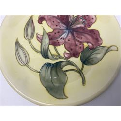 Moorcroft Tiger Lily pattern plate on a yellow ground, with painted and impressed mark beneath, D26cm