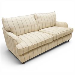 20th century Howard shape two seat sofa, deep seat sofa in cream and grep striped upholstery, raised on dark supports terminating in front castors 