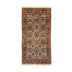 Persian-style wool rug, cream field with floral and geometric motifs, wide floral border (74cm x 142cm); Persian wool rug, beige field with dense floral patterns, narrow floral border (70cm x 144cm); Tribal wool rug, red and navy with diamond motifs (96cm x 60cm); Persian pictorial wool rug, black field with vase, birds, and floral border (70cm x 73cm)
