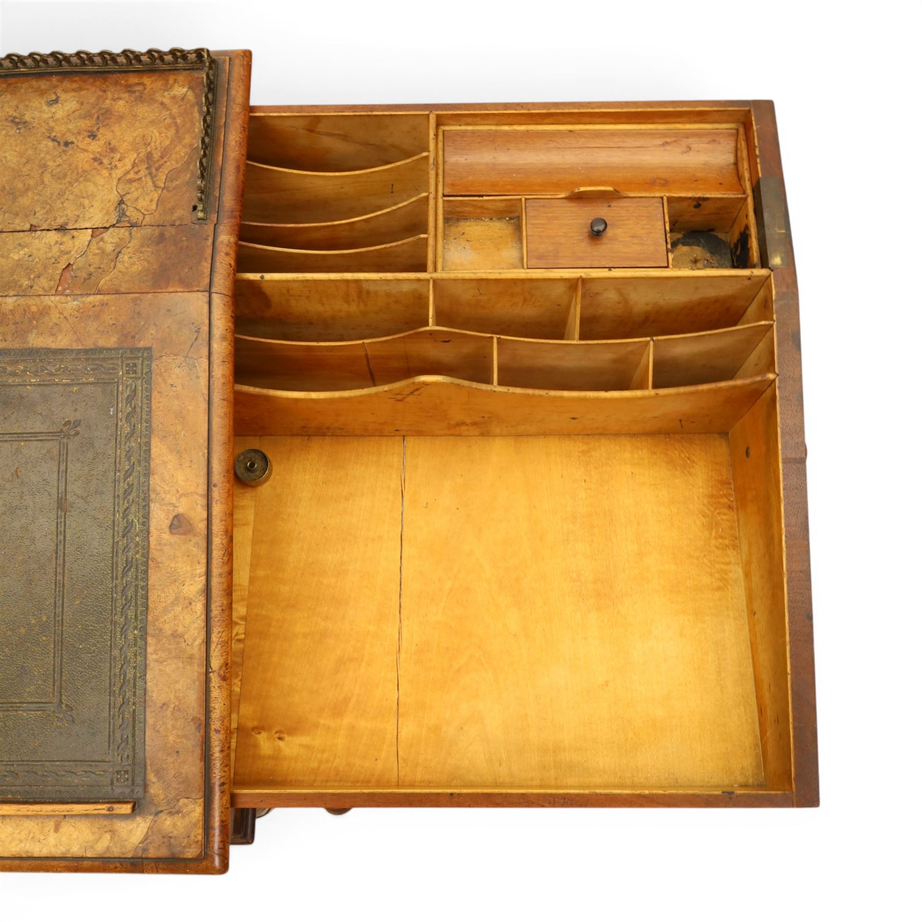 Victorian figured walnut Davenport, the fixed fall with drawer to the side enclosing writing compartment, green tooled leather writing inset, galleried back rail, right side fitted with four drawers behind a panel, opposing panelled side, raised on carved cabriole front supports with scroll terminals and platform base