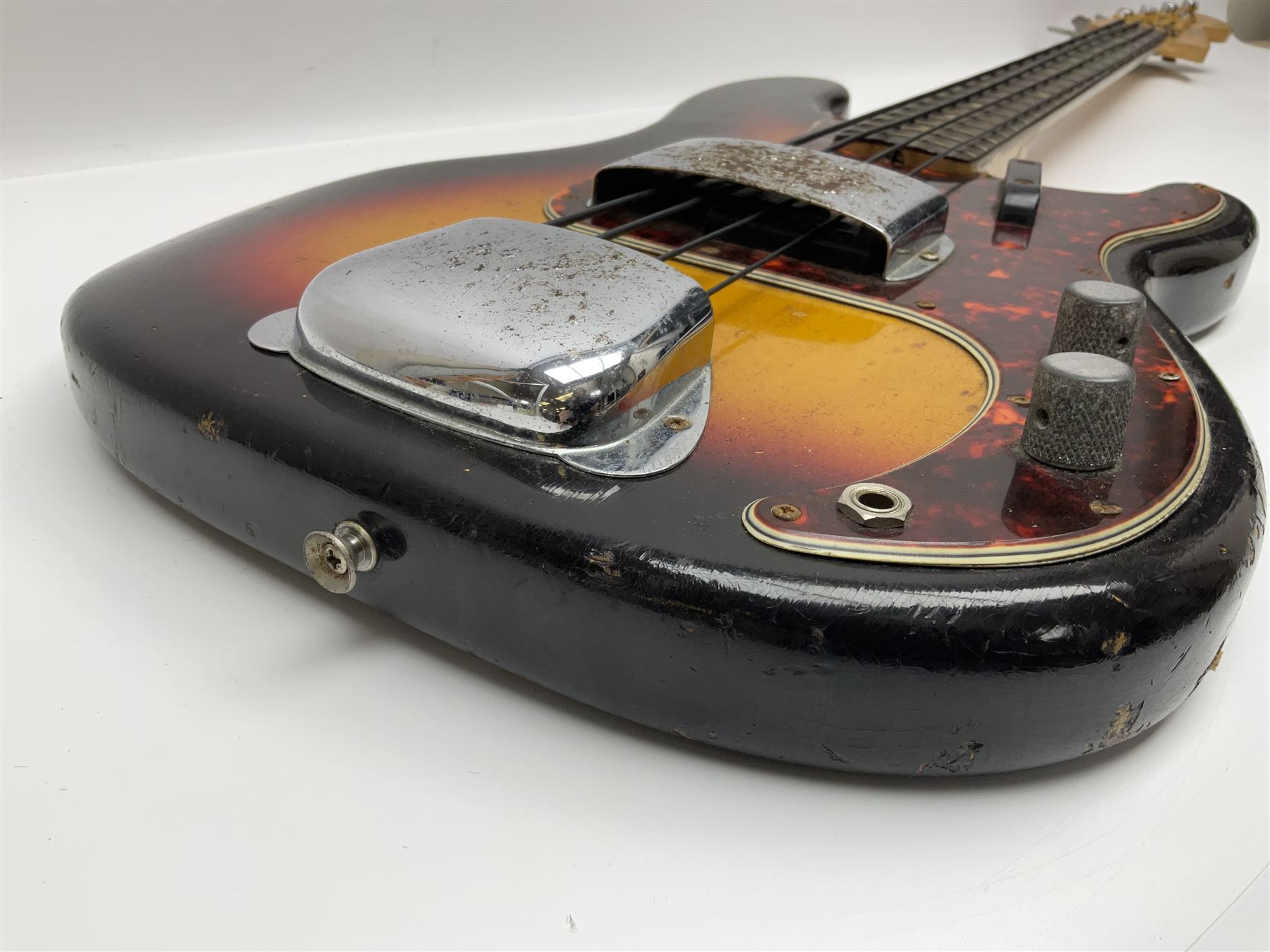 Early 1960s American Fender Precision electric bass guitar with original three-tone sunburst finish and faux tortoiseshell scratch plate; rosewood fretboard; all original fittings including chromium plated bridge and pick-up covers, finger rest, 'pots' and machines, dated on end of neck 5NOV62C, serial no.91625; L115cm overall; in Selmer simulated reptile skin covered carrying case. Sold with non-transferrable CITES A10 licence, certificate no.23GBA10CNKKEB, serial no.441200, dated 30th August 2023. Also included are original 1960s photographs of the band 'The Rascals' and photocopies of newspaper cuttings advertising their forthcoming performances along with a photocopy of a photograph of their television appearance on 'Opportunity Knocks' in 1967/8 (coming second to Mary Hopkins). In addition there is a reel-to-reel tape recording and USB stick of the band playing and two sheets of biographical information. Auctioneer's Note: The guitar was ordered by Trevor Parker from Pat Cornell's Music Shop, Spring Bank, Hull and imported from the USA in 1962, well before it was available in the UK. Trevor was the bass guitarist of The Rascals from Hull, later The Ides of March, who supported artists such as Elton John on the Hull circuit. Trevor played the guitar extensively until 1969 when The Rascals disbanded, he got married to Maureen and settled down to family life. Trevor sadly passed away in 2017, and after being in store for fifty-four years his widow has decided it is time for his guitar to be sold.