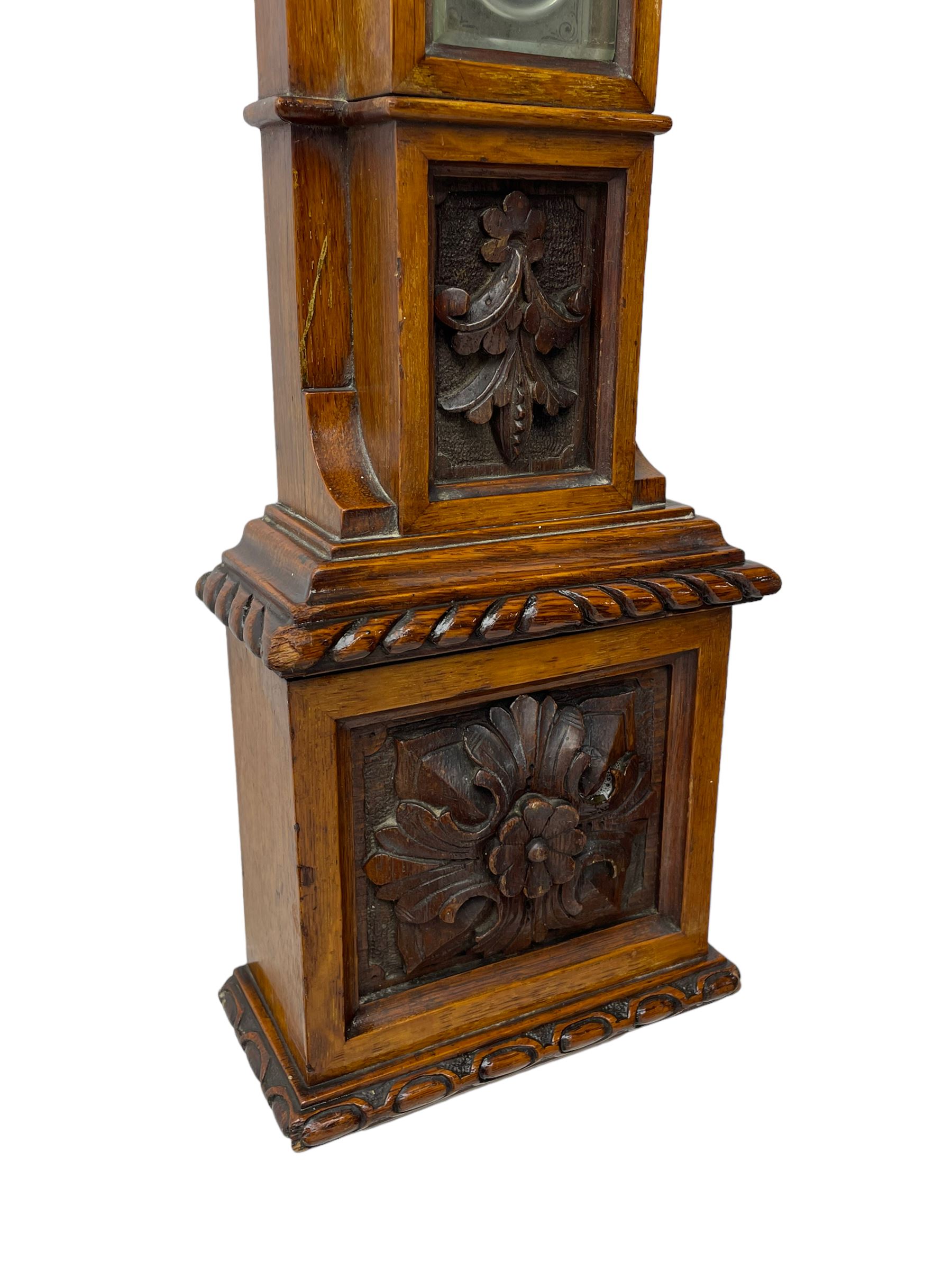 J Hicks - Hatton Garden London, - late 19th century carved oak cased Fitzroy barometer in a richly carved case with a carved crested pediment and square cistern cover, inverted opaline register reflecting FitzRoy's predictions and a scale from 27 to 31 inches of barometric pressure, with a thick bore cistern tube and adjustable rack and pinion twin vernier, fitted with a glazed snail bulb mercury thermometer recording the air temperature in both Fahrenheit and Celsius. Mercury clean and present.
James Joseph Hicks was born in Ireland, however, early in his life he moved to London where he was apprenticed to the instrument maker Louis P Casella. In 1860 he went into business in his own right as a scientific instrument maker at 8 Hatton Gardens. In 1864 he was granted membership to the British Meteorological Society and exhibited instruments at the Royal Society Exhibitions between 1876 and 1913. Hicks was one of London's most prolific and eminent barometer makers. 