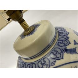 Chinese blue and white table lamp of baluster form, decorated with birds and floral displays, on hardwood base with shade, H78cm