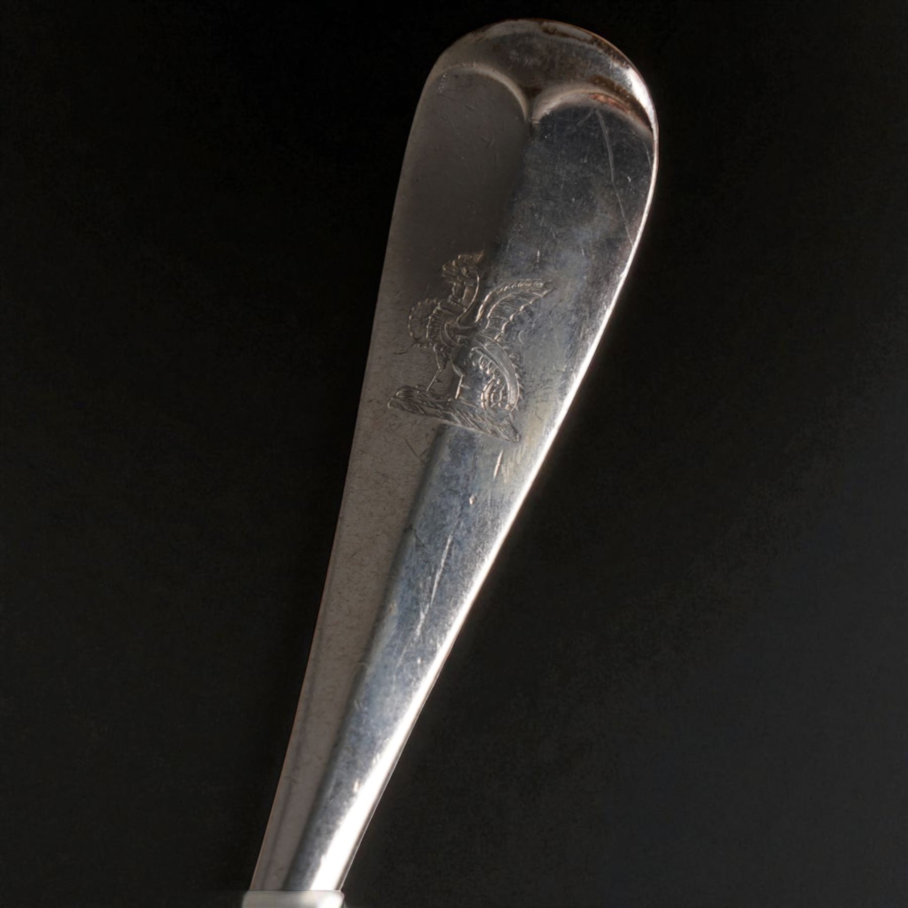 Suite of Edwardian silver rat tail cutlery engraved with a crest comprising twelve table forks, eleven dessert forks, twelve table spoons, eleven dessert spoons, nine teaspoons, soup ladle, pair of sauce ladles and basting spoon Sheffield 1901/02 Maker John Round & Son Ltd