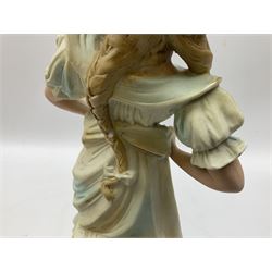 Late 19th century continental spill vase as a young girl standing beside an open tree trunk H21cm; and three German bisque figures (4)