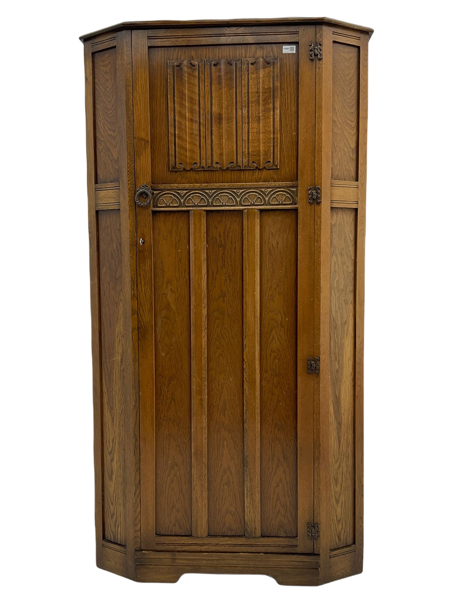 Early to mid 20th century oak hall wardrobe, single door with linenfold panel