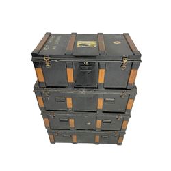 Set four early to mid-20th century metal and wood-bound travelling trunks (three at: W94cm, H32cm, D49cm; one at: W85cm, H32cm, D49cm)