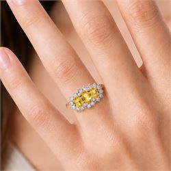 18ct gold yellow sapphire and diamond cluster ring, three oval cut sapphires, surrounded by twenty round brilliant cut diamonds, London 1988, total sapphire weight approx 1.15 carat, total diamond weight approx 0.50 carat
