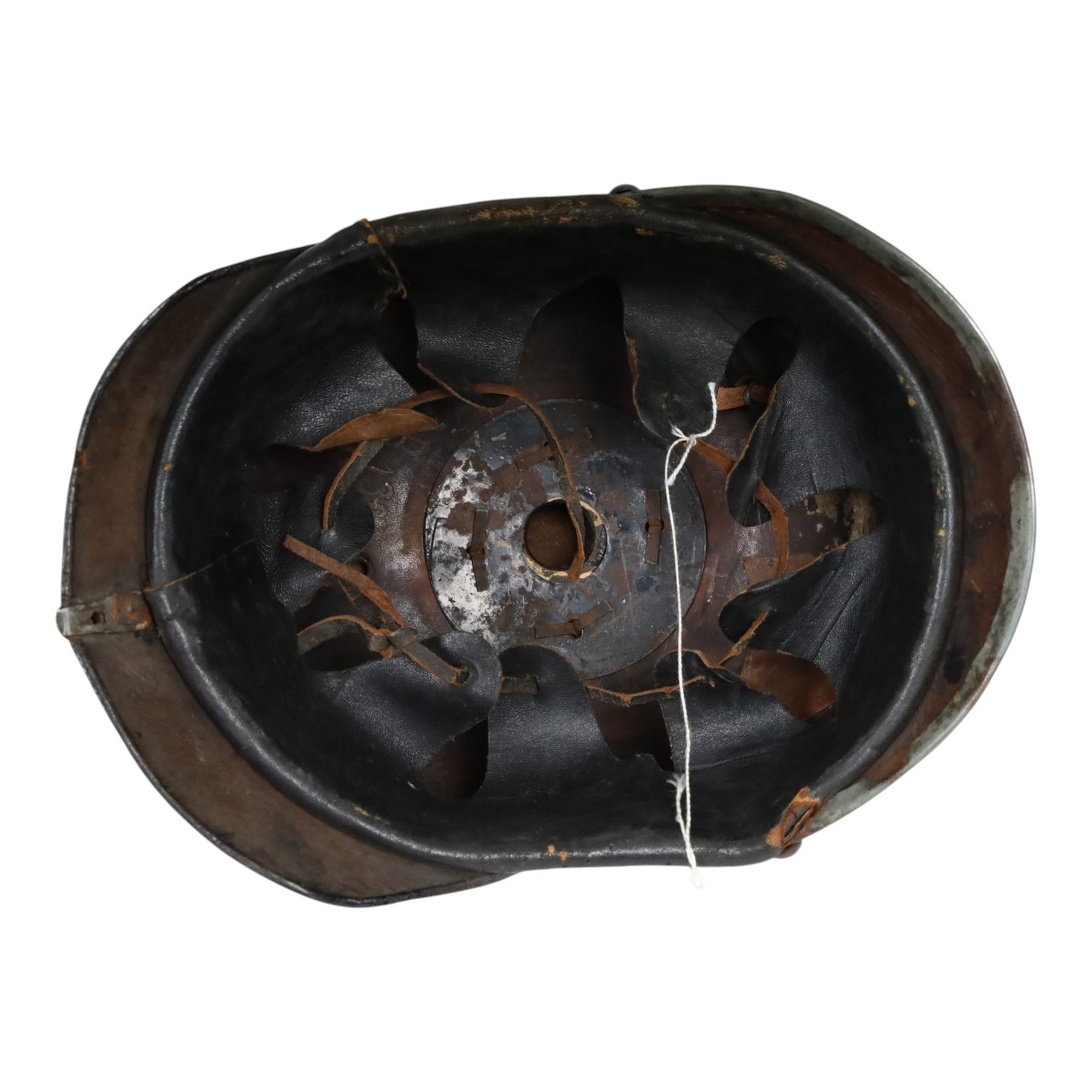 WWI Prussian M1915 Pickelhaube, the black leather skull with removable steel spike finial, steel eagle helmet plate and leather chin strap, one side with a black cockade, the other black and red