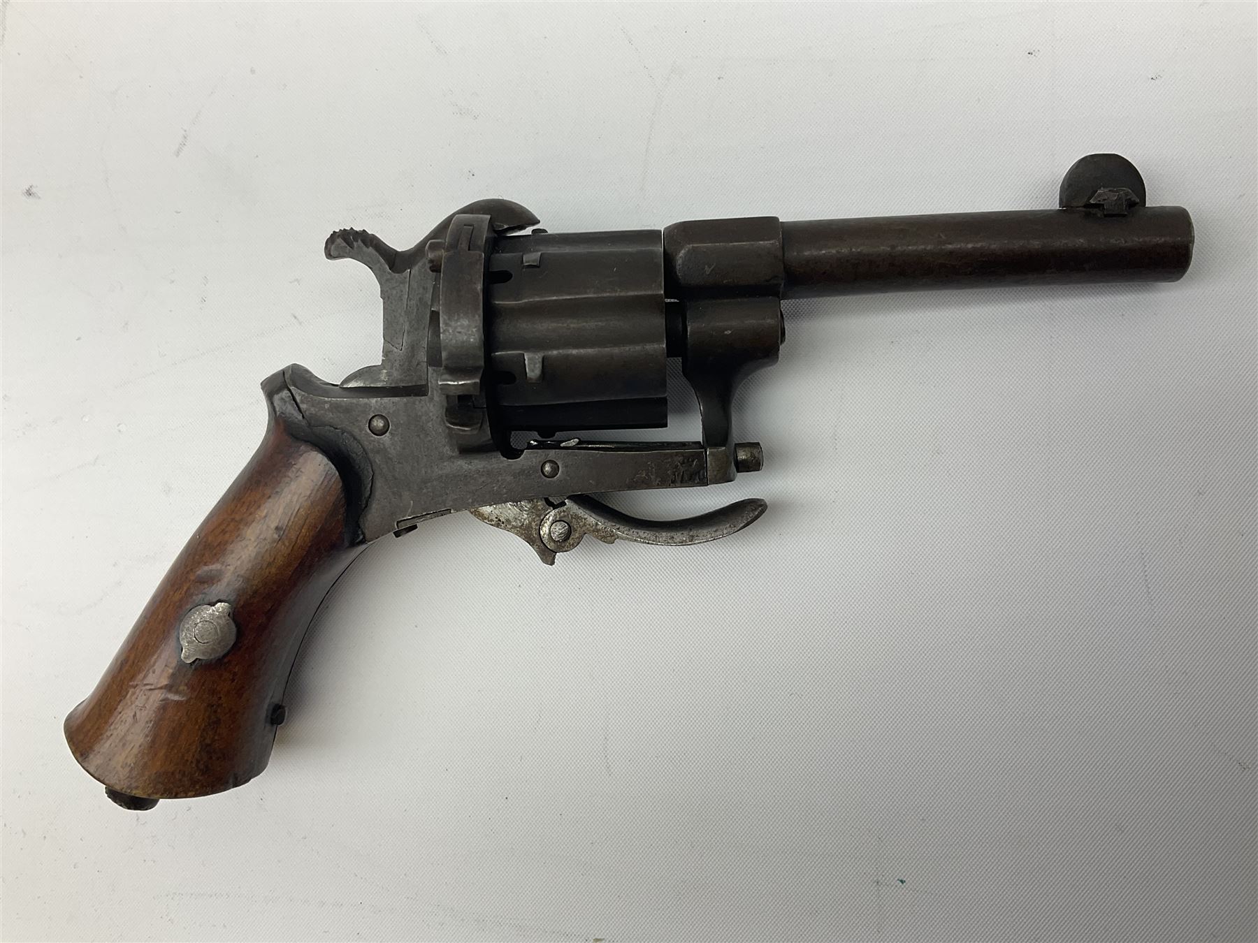 19th century Belgian Flobert 7mm pin-fire revolver with six-shot cylinder, 7cm octagonal to round barrel, folding trigger and walnut stock incorporating ejector rod in butt L18cm overall