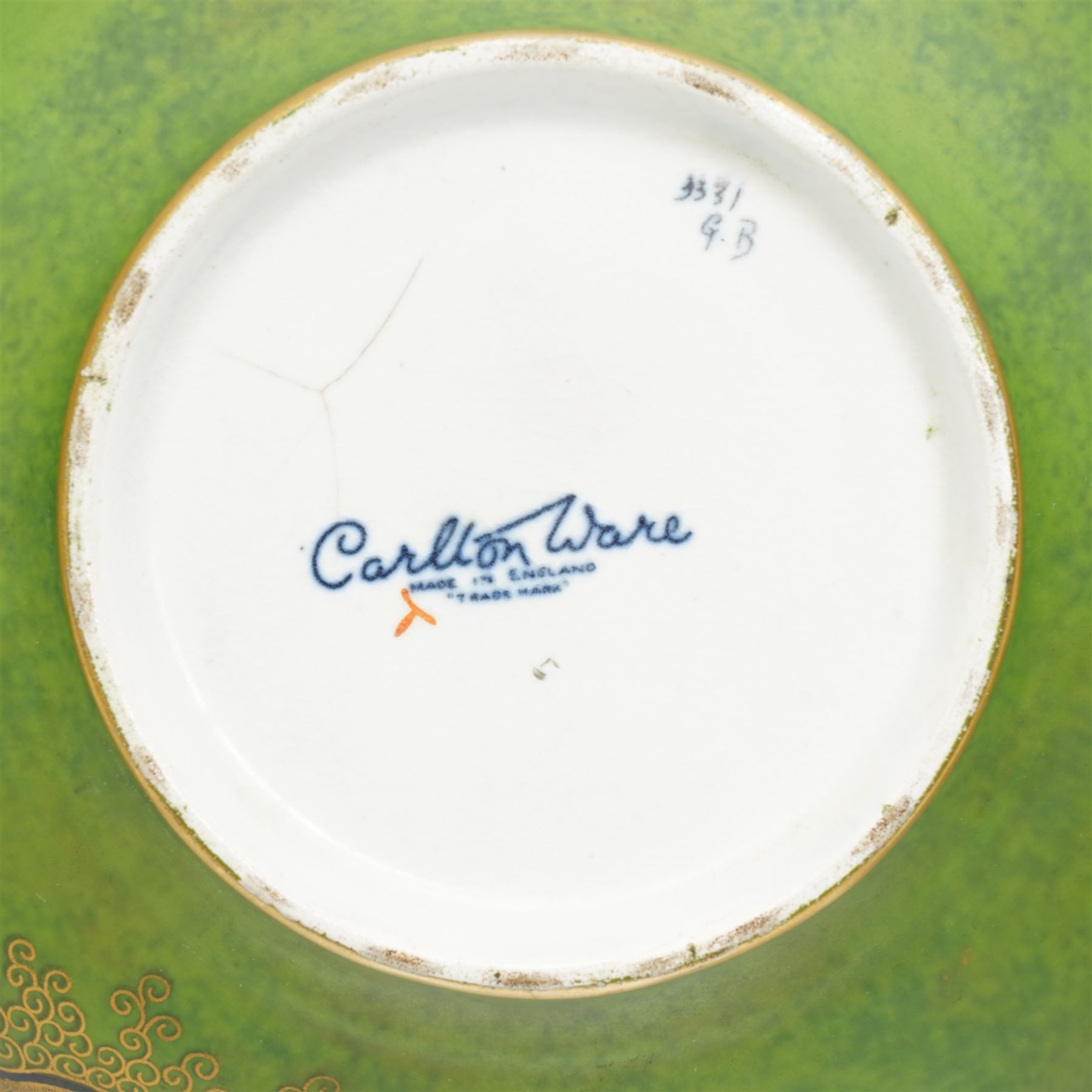 Carlton Ware bowl on stand decorated with Oriental dragon on a green and gilt ground D24cm