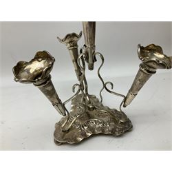 Four hallmarked silver trumpet vases, total weight 108g, upon silver plated stand with foliate decoration and bun feet