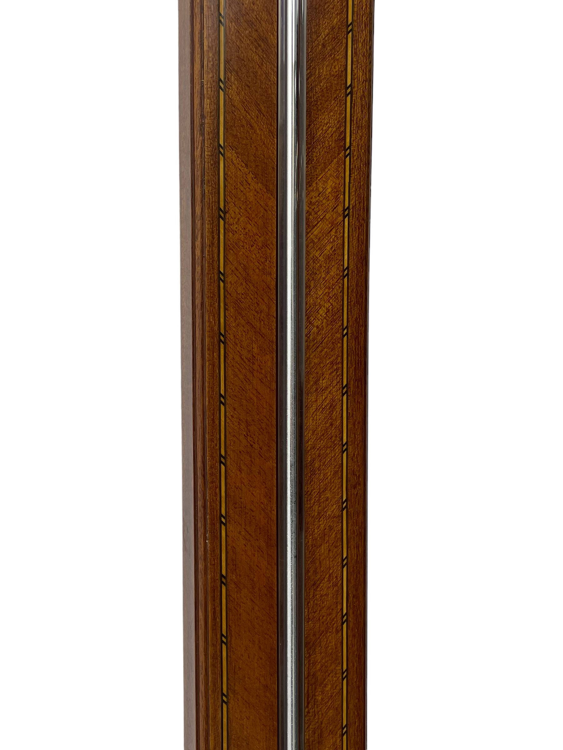 20th century - mercury cistern barometer in an 18th century style mahogany case with contrasting inlay and a broken pediment, round base with a turned cistern cover, fully exposed glass tube and silvered register within a glazed door, with a Fahrenheit spirit thermometer, engraved weather predictions and sliding vernier. Mercury clean and present.
