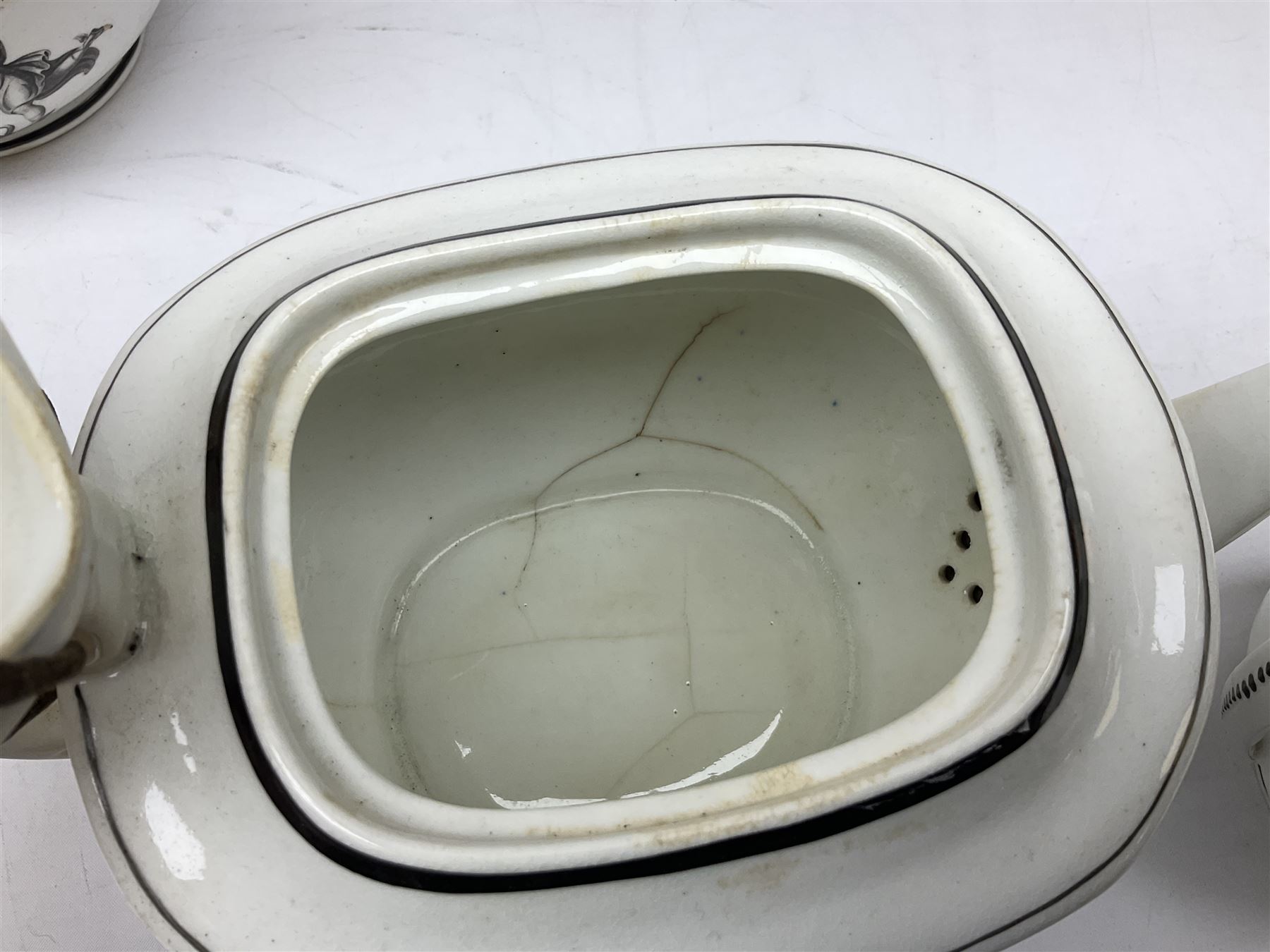 Early 19th century Staffordshire bat printed part tea service, decorated in black after Adam Buck with scenes of mother and child and other varying classical style scenes, within black bands, comprising teapot, slop bowl, jug, seven teacups and five saucers 