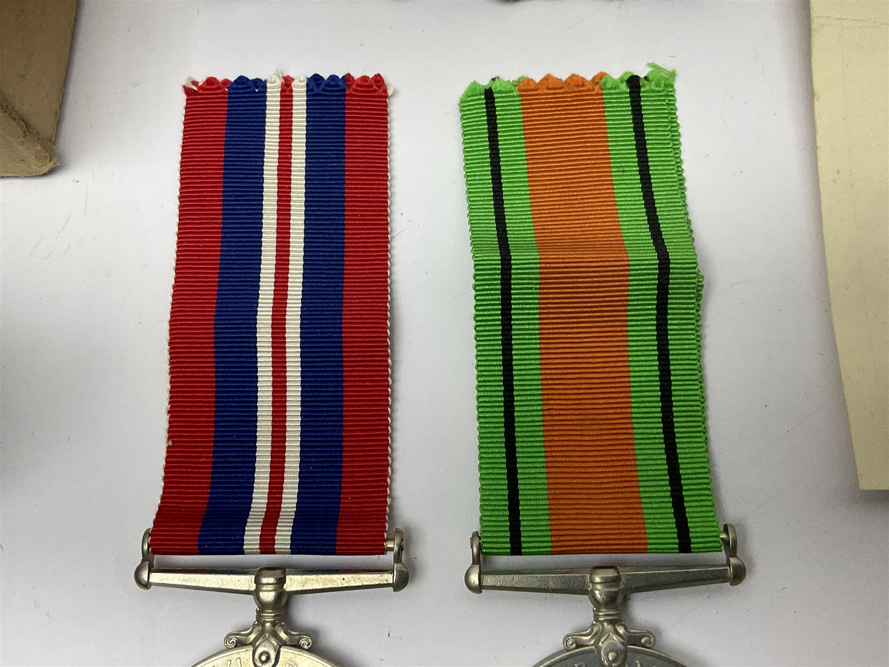 WWI pair of medals comprising British War Medal and Victory Medal awarded to 380807 Pte. W. Hayles Hamps. R.; Imperial Service Medal awarded to William Hayles; cased and boxed; WWII 1939-1945 War Medal and Defence Medal in issue box with slip; 1930s hallmarked silver football presentation fob etc