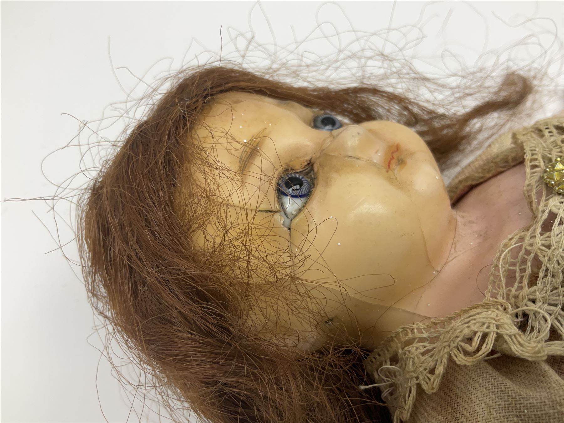 Victorian wax shoulder head doll with applied hair, inset glass eyes and jointed body with composition lower limbs; faded pink dress H35cm