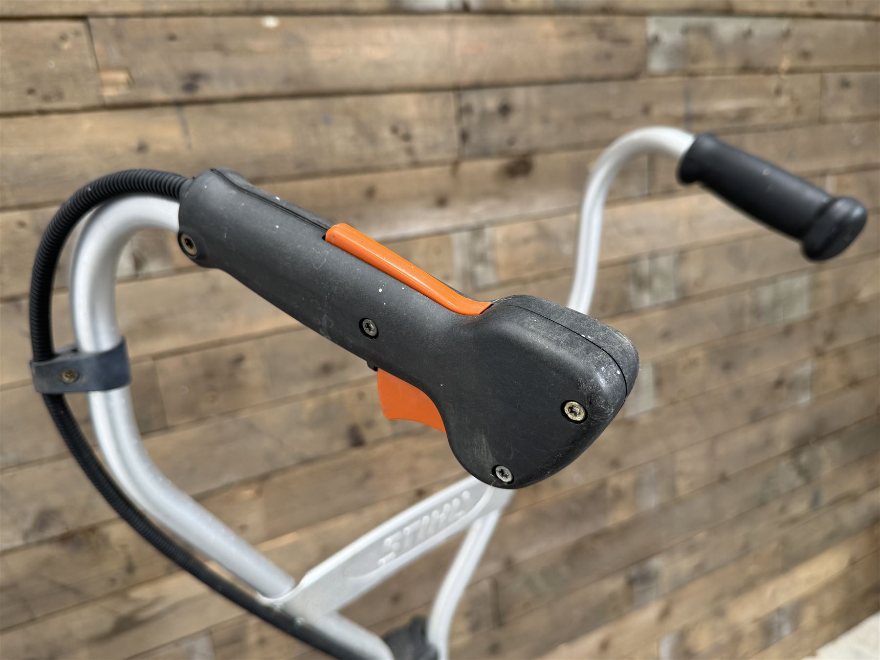 Stihl MM55 petrol multi system with scarifier attachment