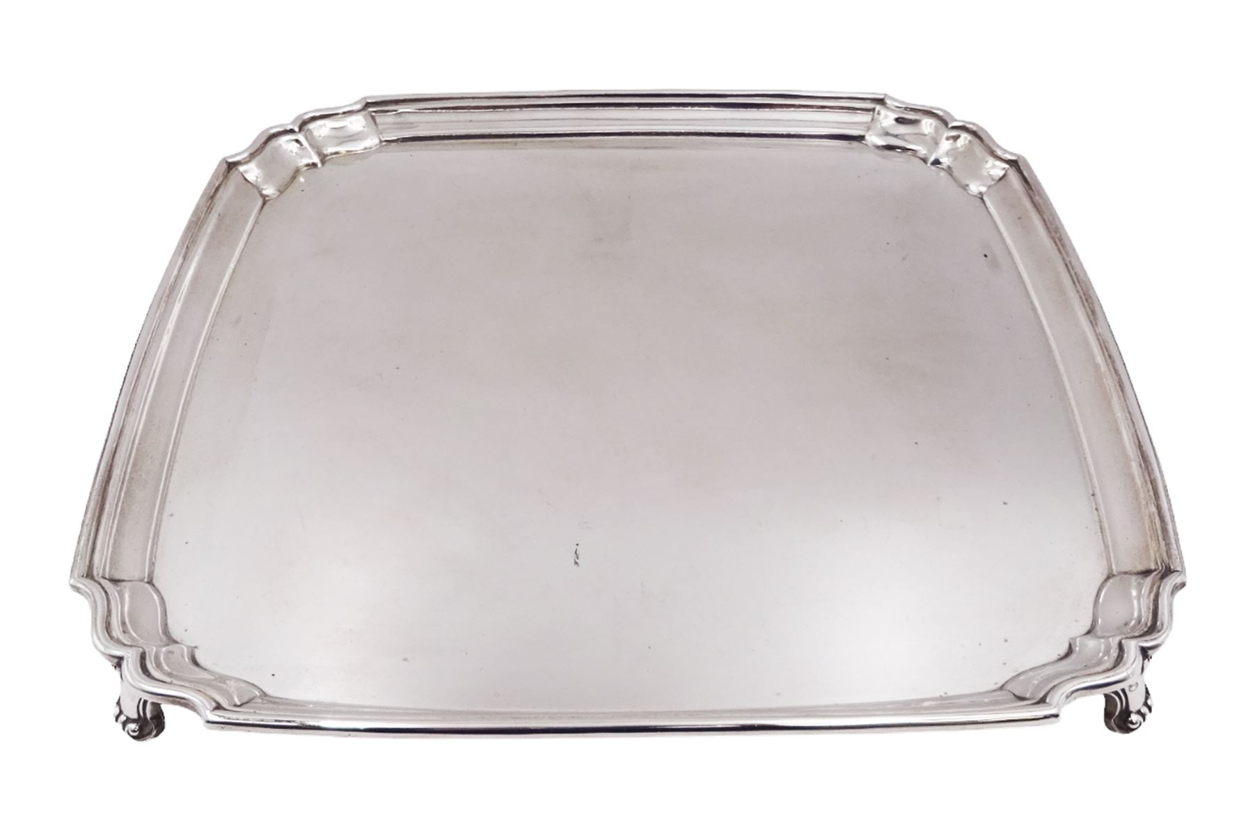 1930s silver tray, of square form with shaped canted corners and stepped rim, upon four bracket feet, hallmarked Frank Cobb & Co Ltd, Sheffield 1936, W31cm
