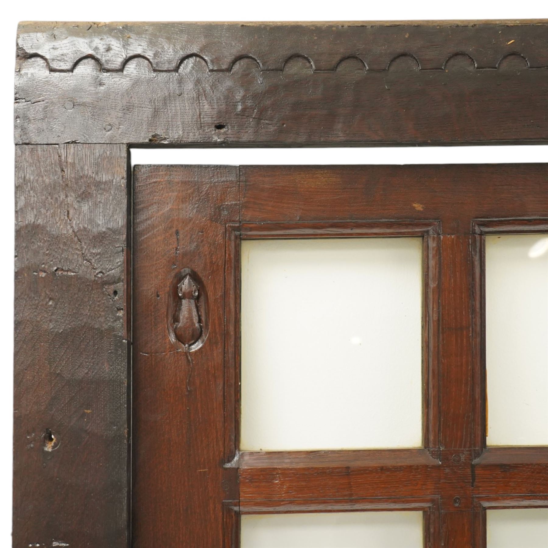 Mouseman - 1940s glazed, panelled and adzed vestibule door with castellated frame, with carved mouse signature, by Robert Thompson of Kilburn
