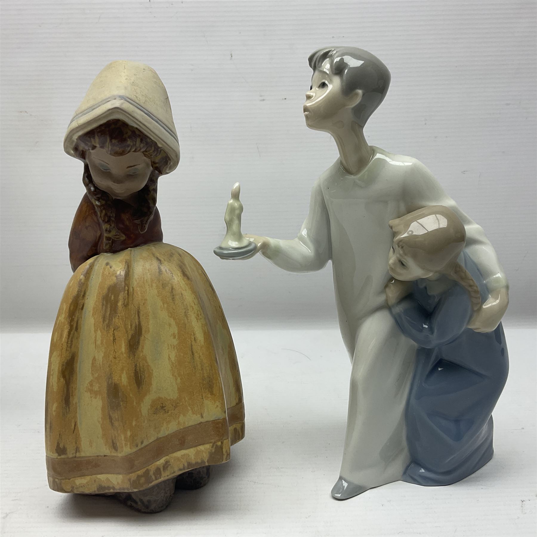 Four Lladro figures, including Girl With Cockerel no 4591, Gres Lonely no 2076 etc together with Nao figure 