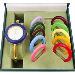 Gucci ladies gold-plated quartz wristwatch, Ref. 11/12.2, with eleven interchangeable coloured ring bezels, boxed with warranty card dated 1997 
