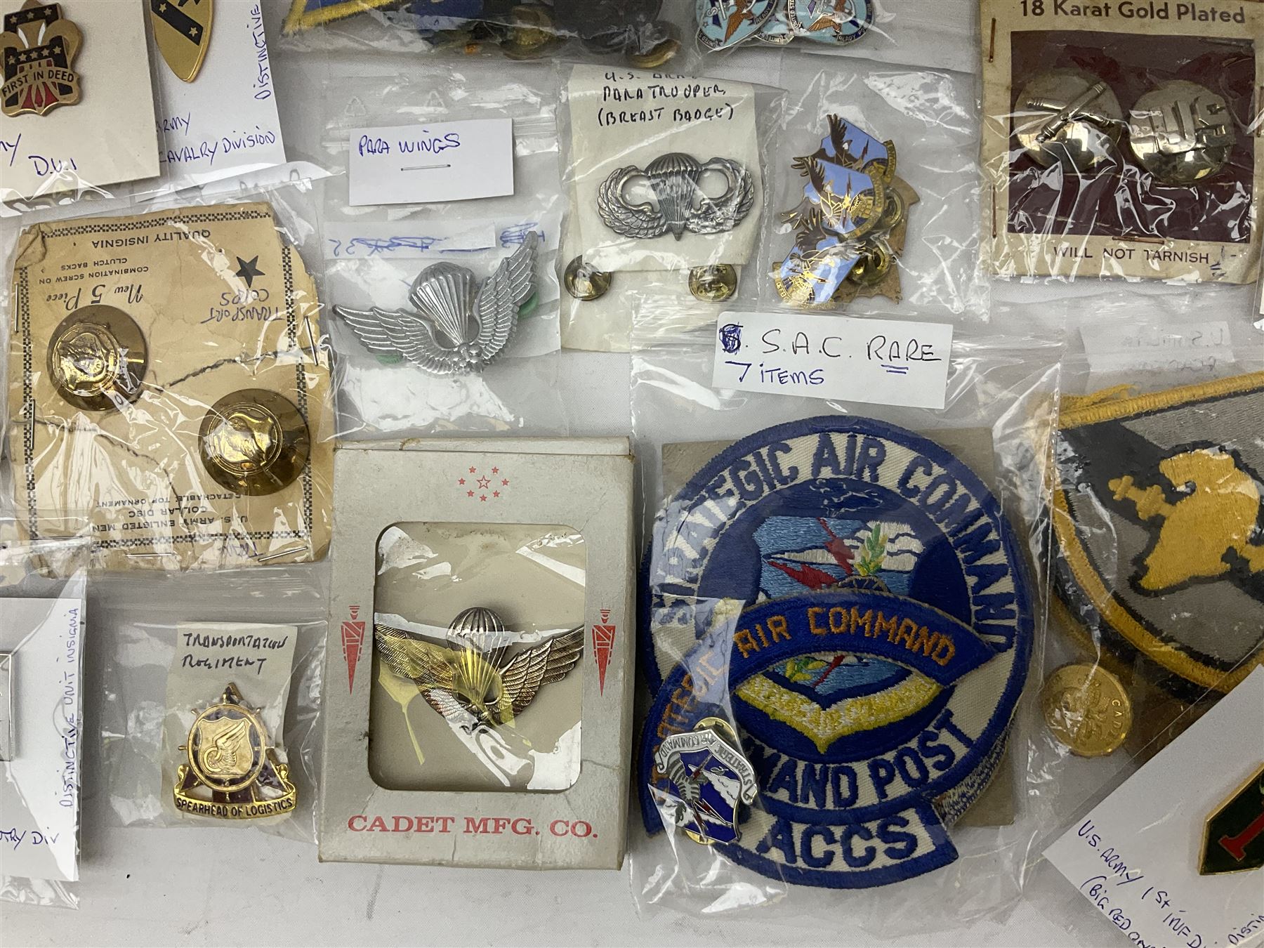 American patches and badges, including para wings, USS Constellation, Strategic Air Command, U.S. military academy, health service regt, Navy Seals, Air Defence Command, Seventh Fleet, various collar badges etc