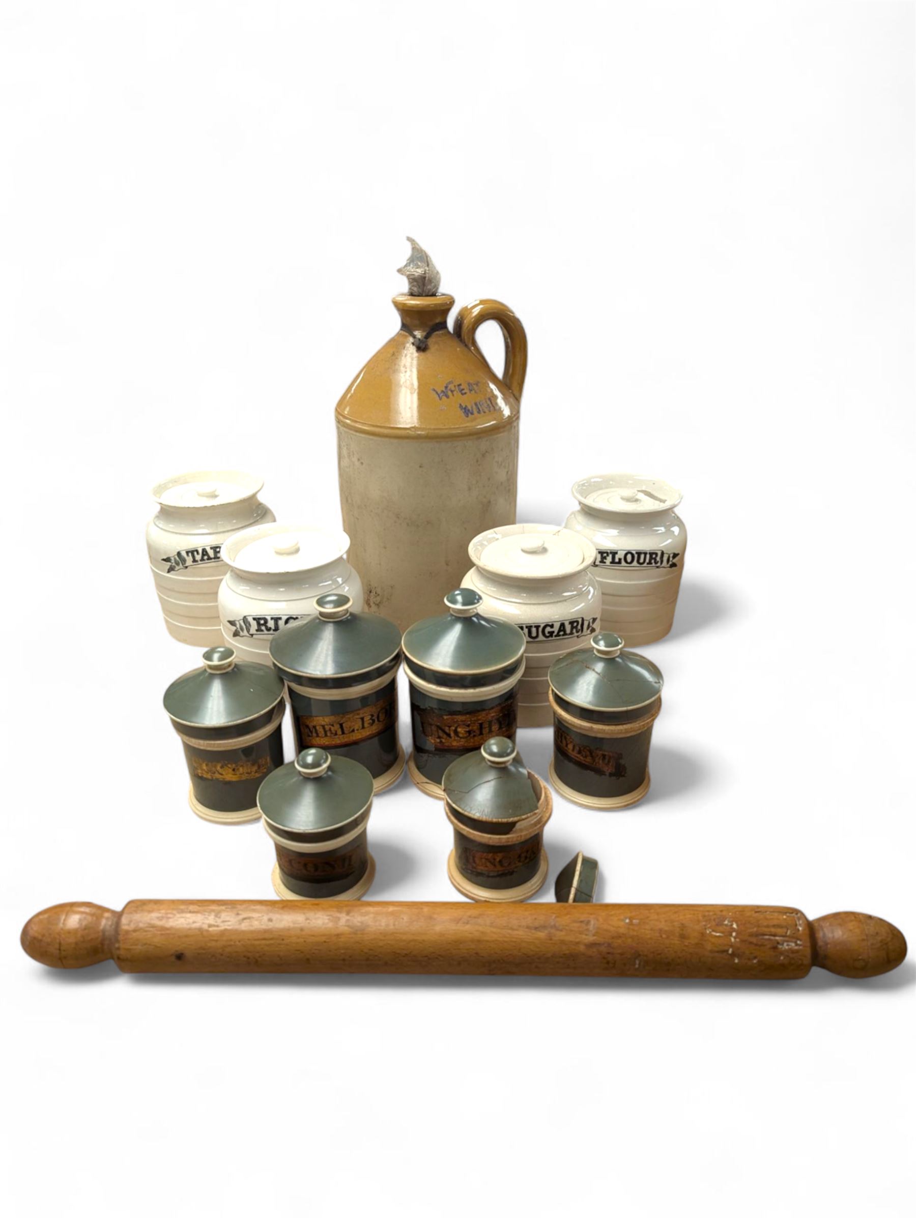 19th century sage green apothecary jars with gilt labels, four white ceramic kitchen jars and a stoneware flaggon marked Wheat Wine