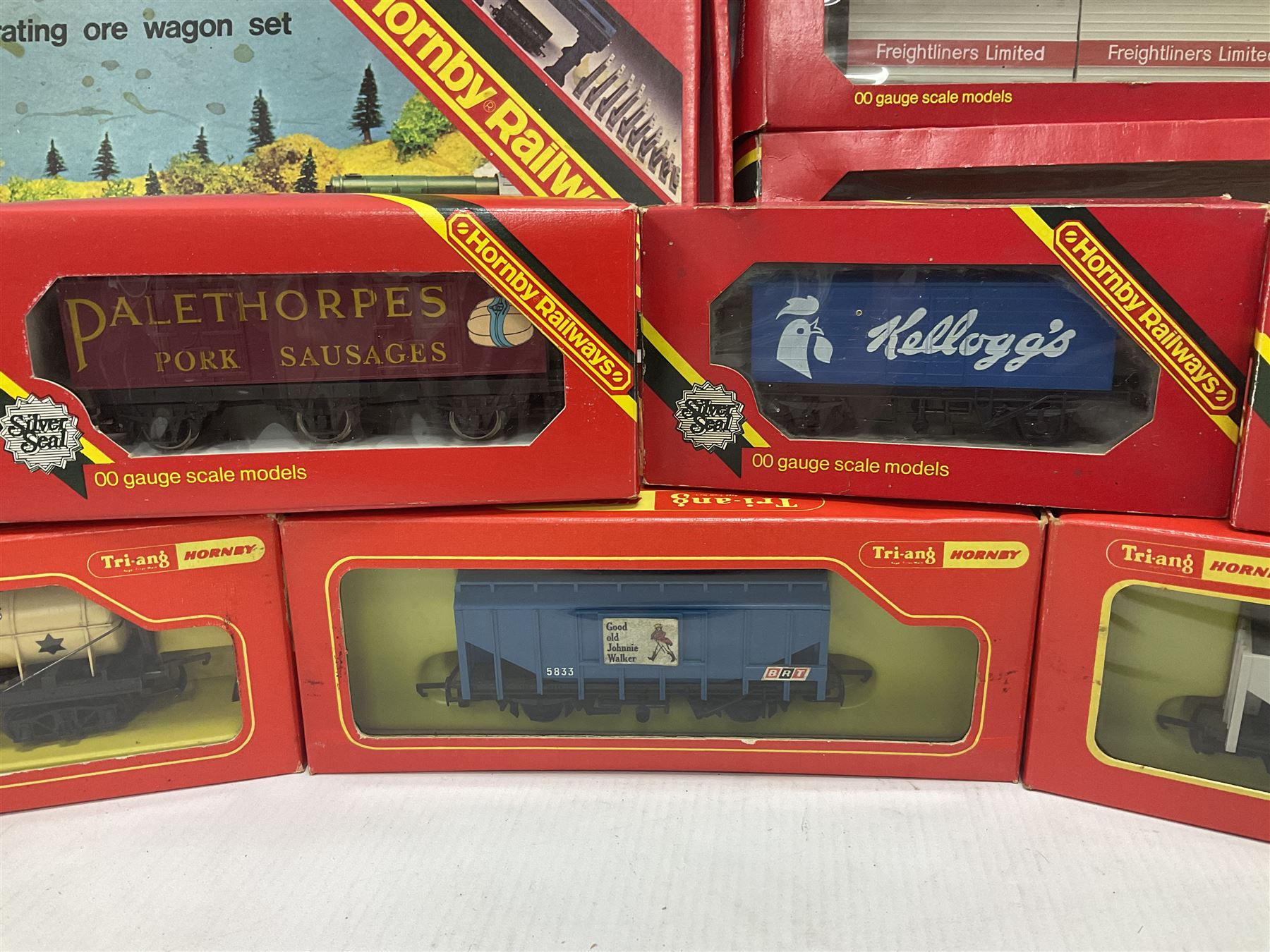 Hornby/Tri-Ang ‘00’ gauge - fifteen goods wagons to include freightliners with containers, ore wagons, closed vans etc; together with R404 Operating ore wagon set; all boxed (16) 