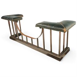 Early 20th century brass and buttoned green leather club fender with plain uprights 