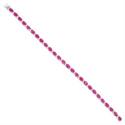 18ct white gold ruby and diamond bracelet, twenty-six oval cut rubies, each spaced by two ...