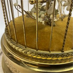 Swiss Reuge Music bird cage automaton music box, the bird with articulated head and beak, in a gilt brass cage, with a glass dome and stand, H30cm